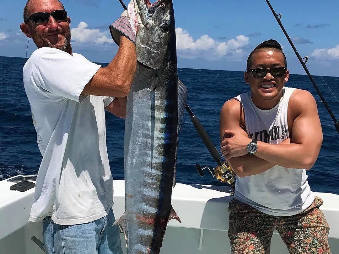Anglers with a wahoo caught aboard Spellbound, Miami