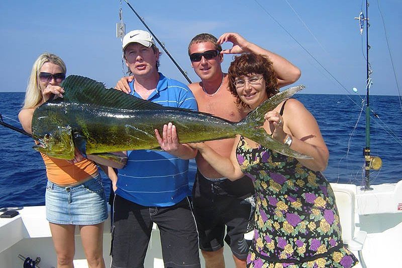 Group of anglers with a big mahi mahi aboard Spellbound, Miami