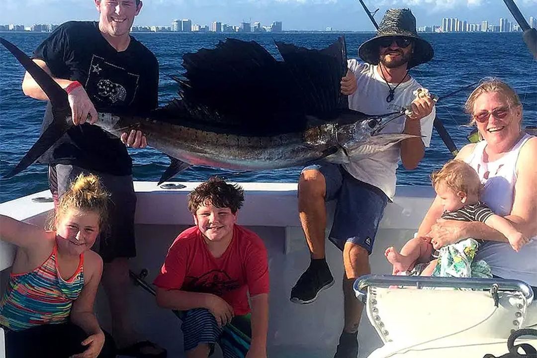 A family with their sailfish catch aboard Spellbound, Miami